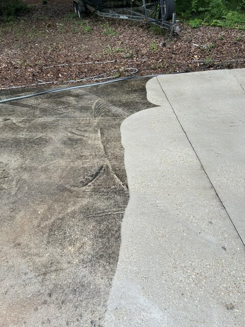 Concrete driveway — before and after pressure washing
