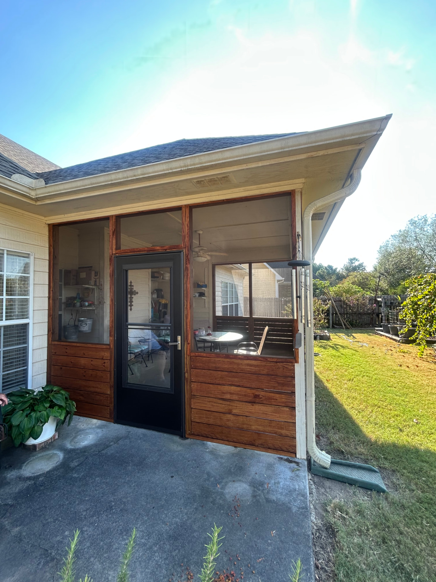 New screened porch enclosure with stained wood panels
