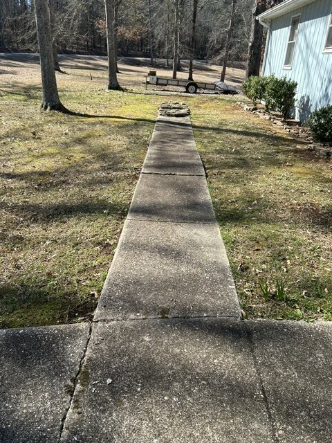 Concrete walkway before cleaning